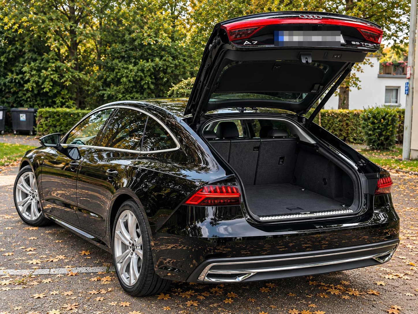 Audi A7 Sportback, side three-quarter view with cargo area open